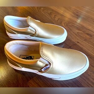 Never worn, gold Van slip-ons, size 12.5 kids
